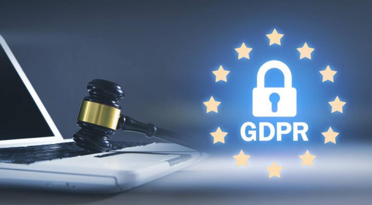 A person typing on a laptop with a prominent GDPR logo and a padlock graphic, symbolizing data protection and privacy.