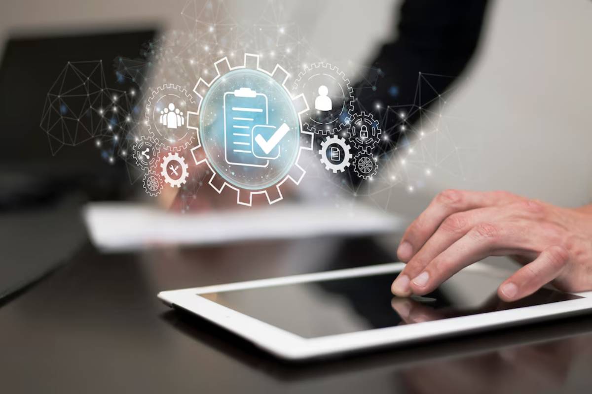 A person interacts with a tablet, surrounded by digital icons representing productivity, checklists, and collaboration.